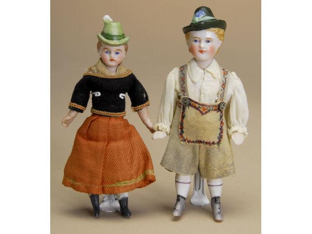 Appraisal: Pair of Small Boys with Molded Hats Germany ca fine