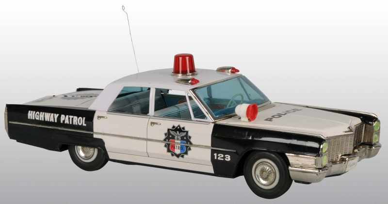 Appraisal: Tin Highway Patrol Cadillac Car Friction Toy Description Japanese Circa