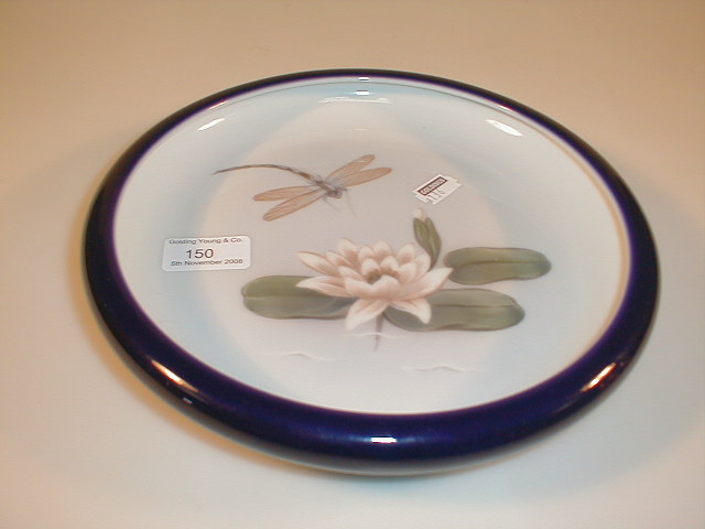 Appraisal: A Royal Copenhagen shallow bowl with lily flower and dragonfly