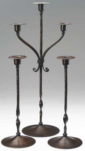 Appraisal: ROYCROFT Three tall candlesticks with twisted stems a pair and