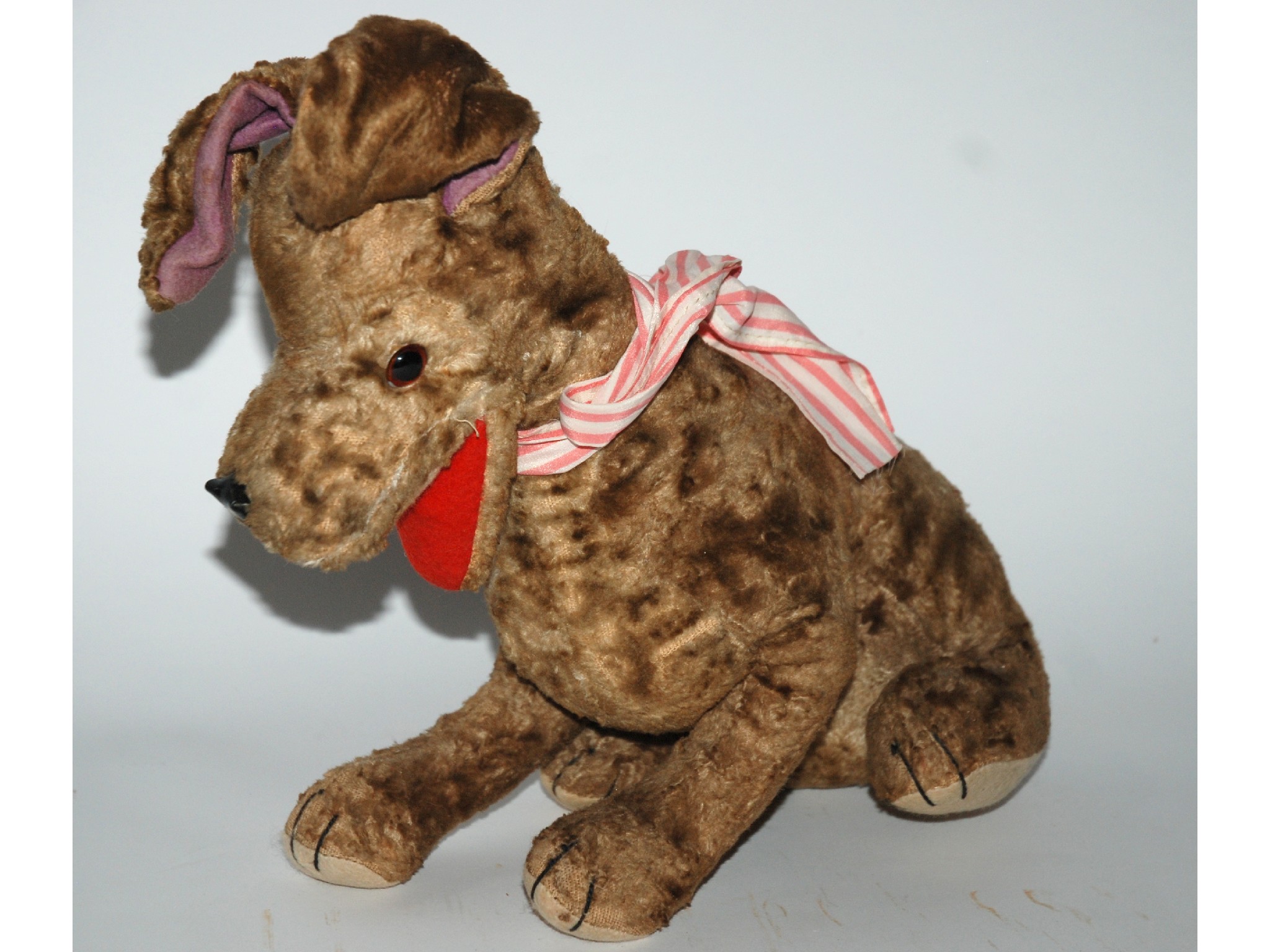 Appraisal: A Merrythought dog soft toy with label on right paw