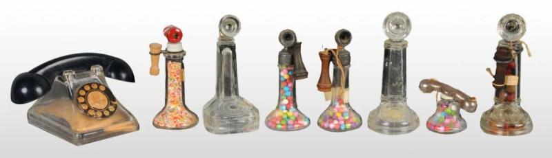 Appraisal: Lot of Glass Telephone Candy Containers Description Includes two stick