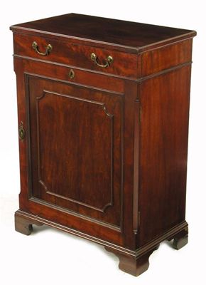 Appraisal: A mahogany cabinet with a frieze drawer and a panelled