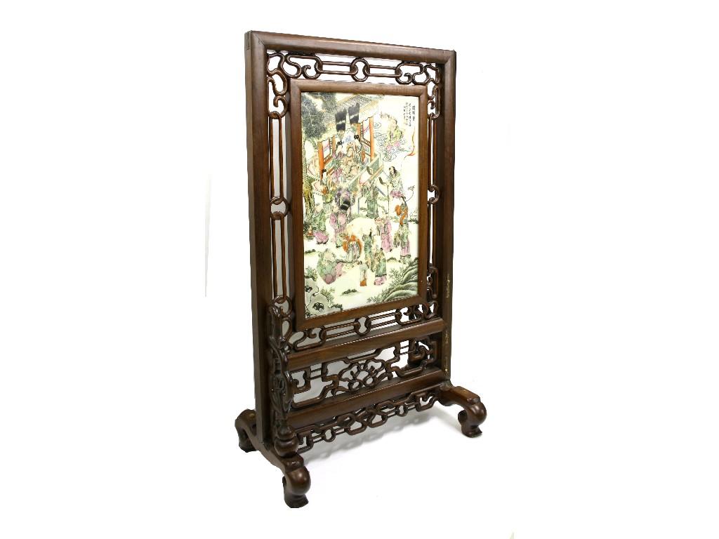 Appraisal: th century Chinese hardwood pierced table screen fitted with a