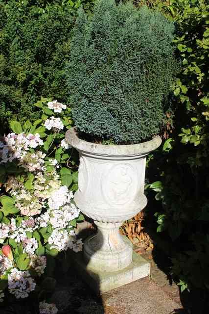 Appraisal: A RECONSTITUTED STONE PLANTER in the form of a classical