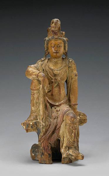 Appraisal: A polychromed wood figure of Guanyin Ming Dynasty A kneeling