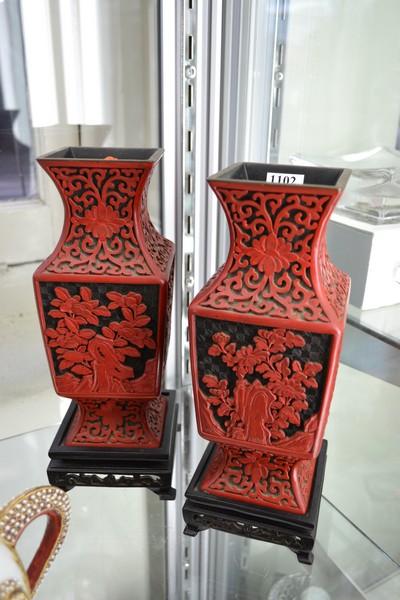 Appraisal: PAIR OF CINNABAR STYLE VASES ON STANDS BOTH WITH EXTENSIVE