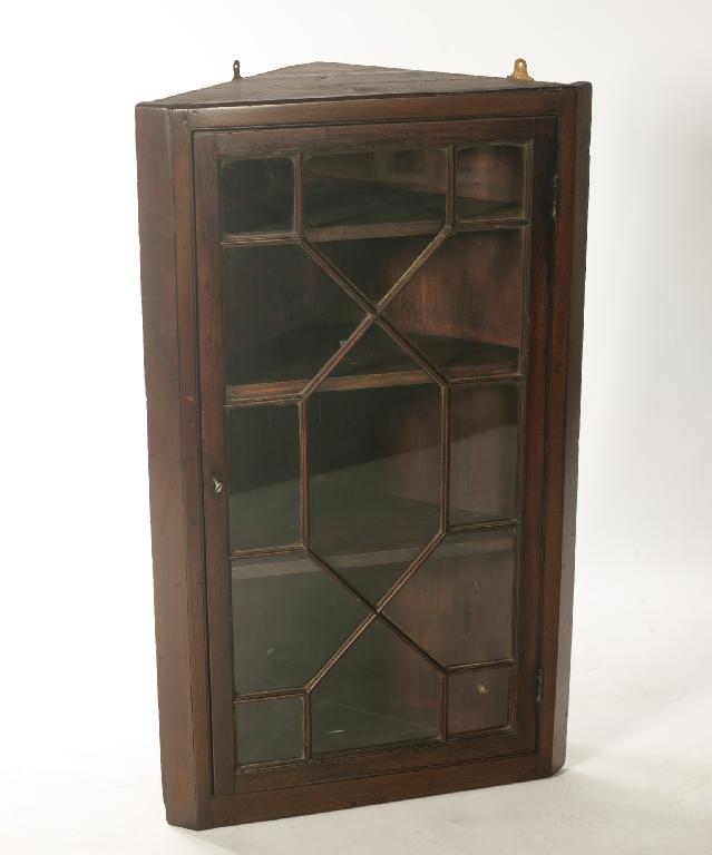 Appraisal: th CENTURY MAHOGANY GLAZED HANGING CORNER CUPBOARD with astragal glazed