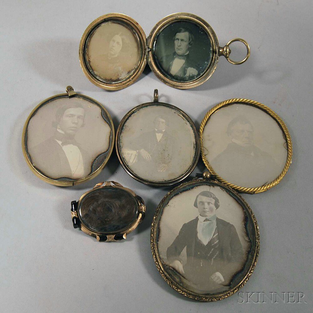 Appraisal: Six Gilt-brass Cases with Seven Daguerreotype Portraits three oval pendant