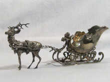 Appraisal: A silver plated model of a reindeer drawing a sleigh