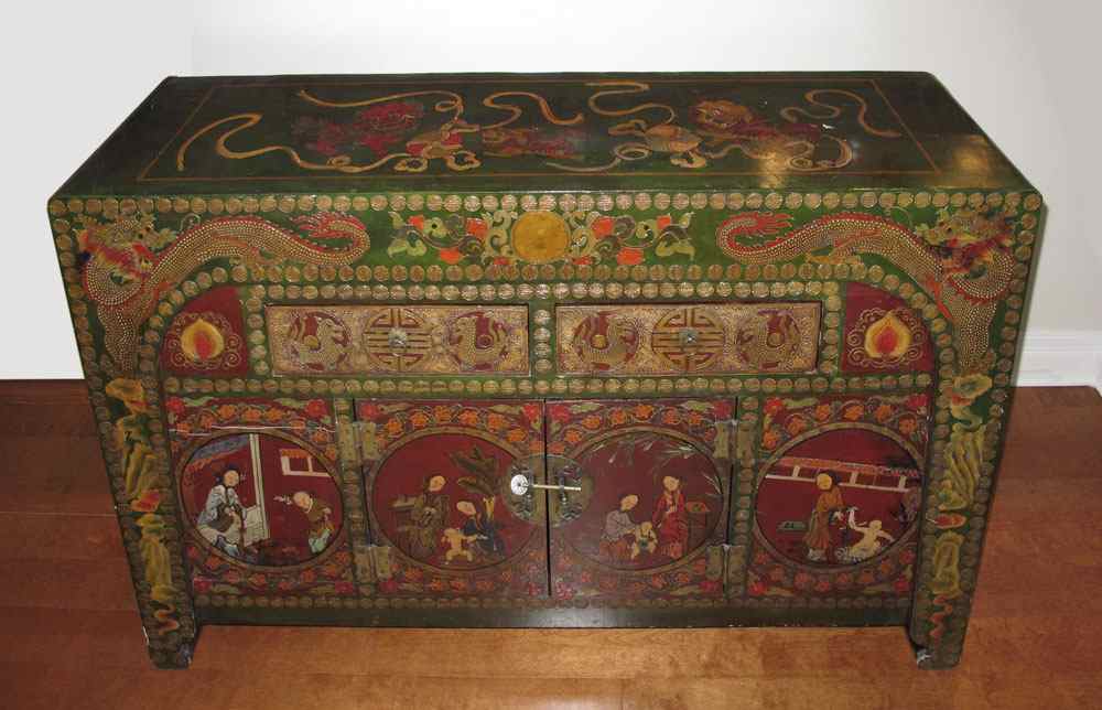 Appraisal: HIGHLY DECORATED TIBETAN CHEST Paint decorated with with vignettes of