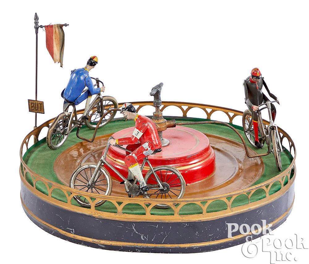 Appraisal: French painted tin clockwork bicycle race toy French painted tin