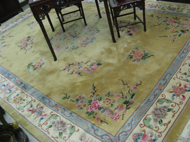 Appraisal: CHINESE CARPET traditional Peking floral design on plain gold ground