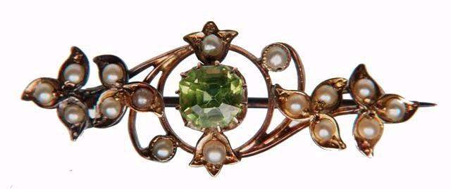 Appraisal: A LATE VICTORIAN PERIDOT AND PEARL SET BROOCH in the