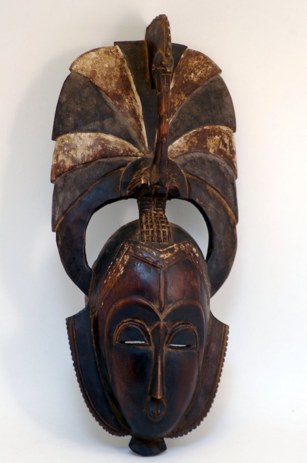 Appraisal: Yaure mask of dark brown patinated wood having a small