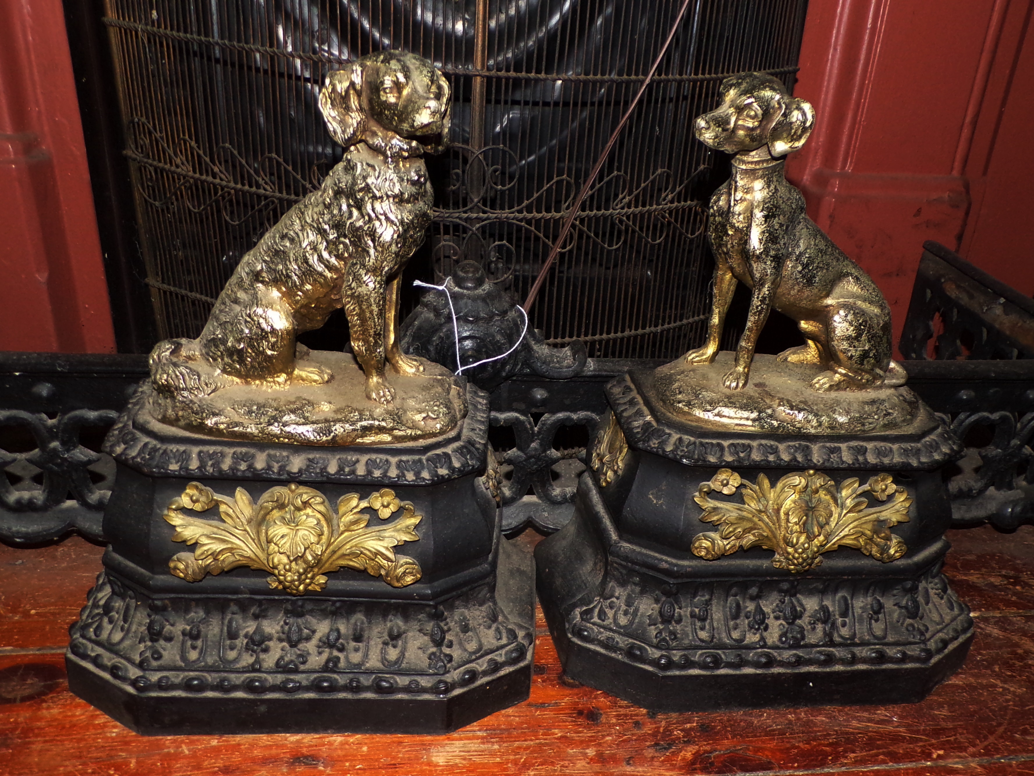 Appraisal: Fire place set- fender and andirons of Dogs Seated on