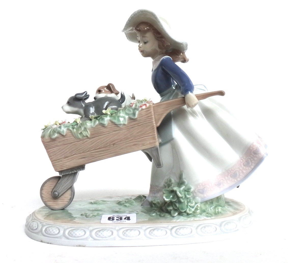 Appraisal: A Lladro figure modelled as a young girl pushing a