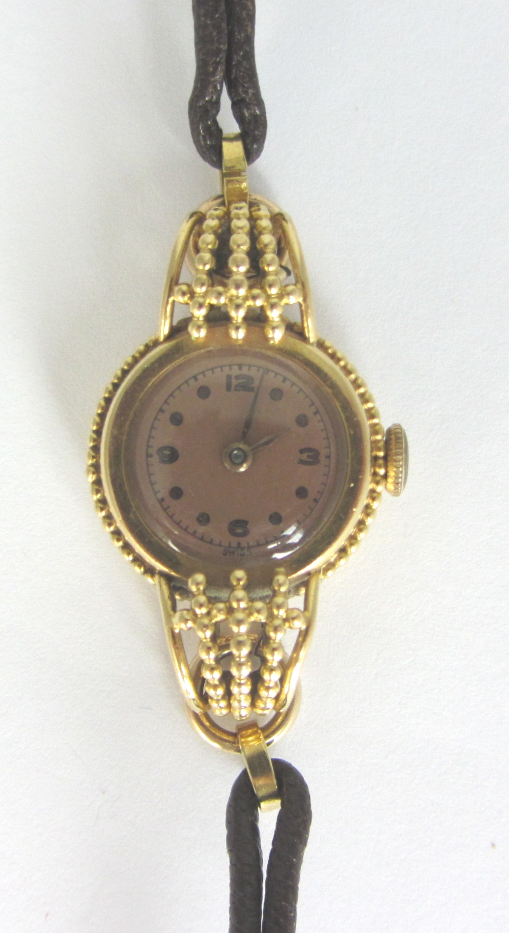 Appraisal: A ladies French gold circular cased wristwatch with an unsigned