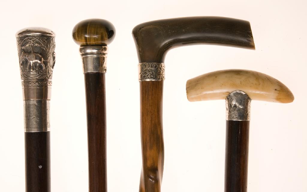 Appraisal: LATE th CENTURY SILVER-COLLARED TIGER'S EYE WALKING CANE the tiger's