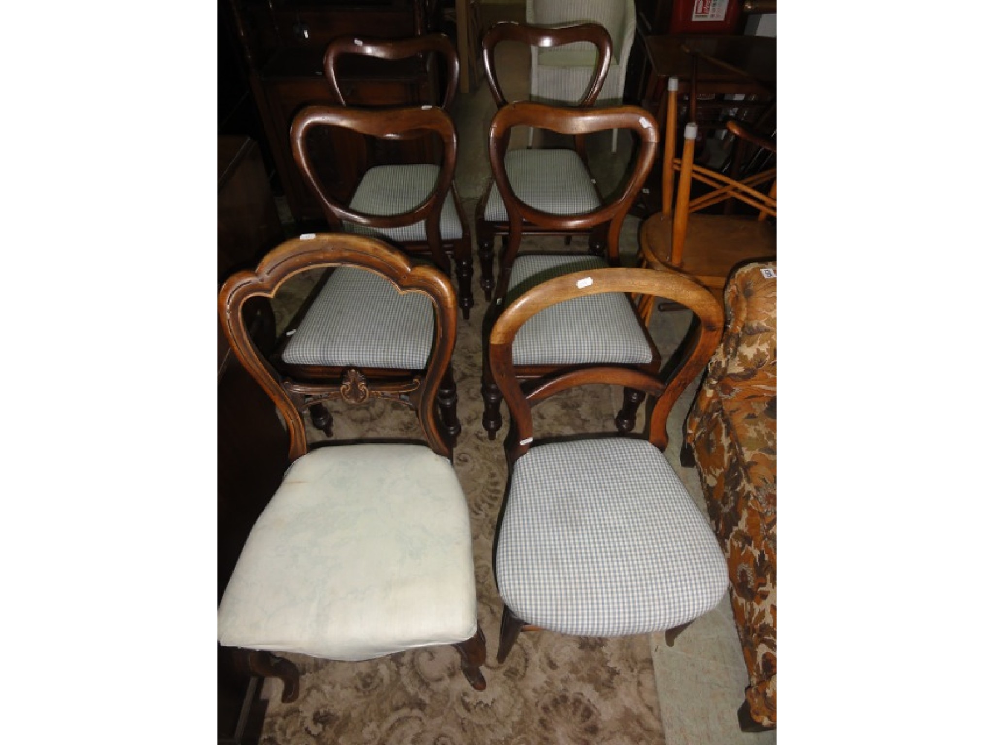 Appraisal: A set of four Victorian mahogany dining chairs with kidney