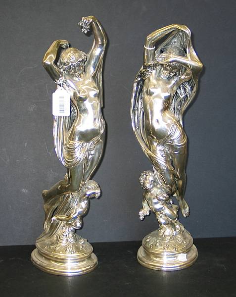 Appraisal: A pair of French metal clad maidens allegorical of night