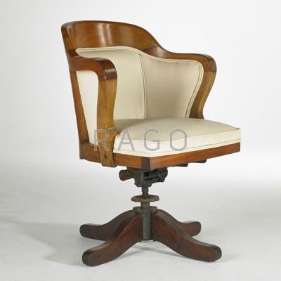 Appraisal: INDUSTRIAL Swivel tilt desk chair USA s Stained and lacquered