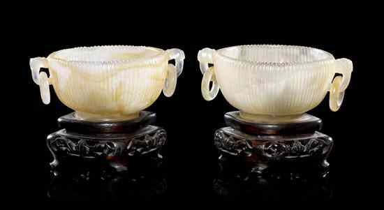 Appraisal: A Pair of Chinese Carved Agate Handled Bowls having reeded