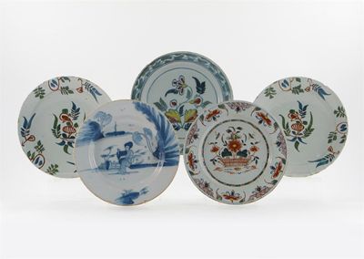 Appraisal: Four Delftware plates painted in shades of green iron red