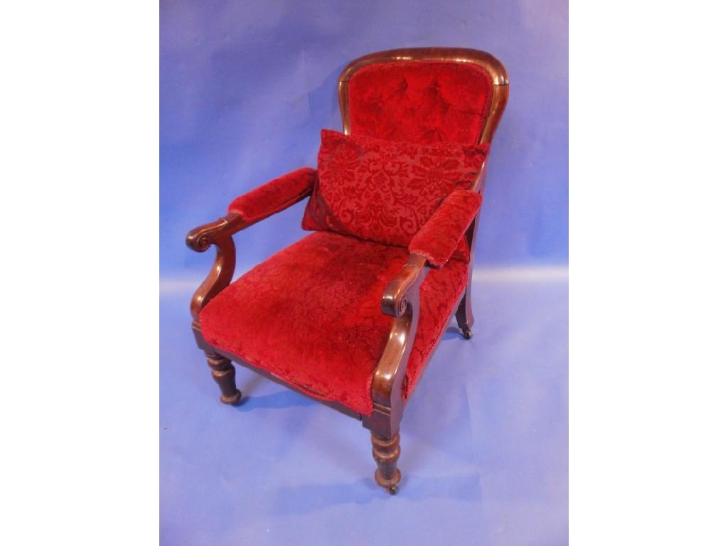 Appraisal: A Victorian rosewood spoon back open armchair in red velvet