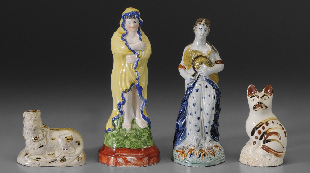 Appraisal: Four Prattware Figures British late th century woman holding sheaves