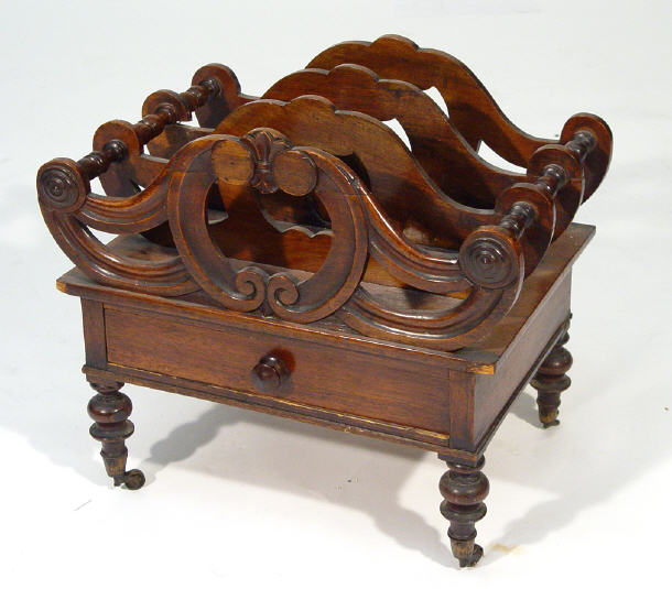 Appraisal: Regency rosewood four section Canterbury with C-scroll and roundel decoration