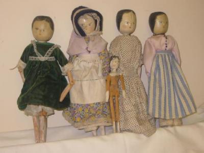 Appraisal: Five painted wood peg dolls with painted heads four high