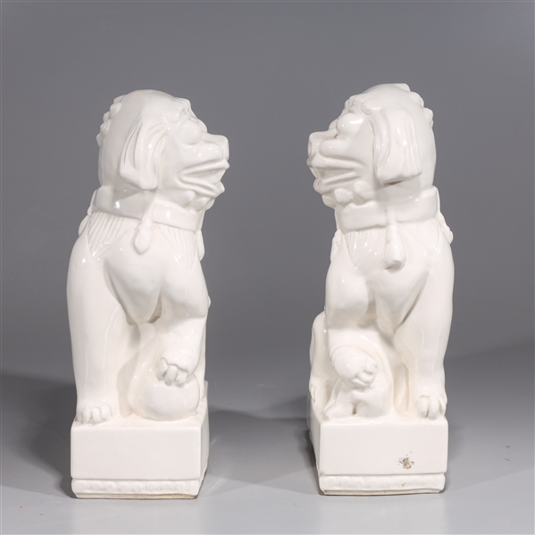 Appraisal: Pair of Chinese porcelain foo lions H x W x