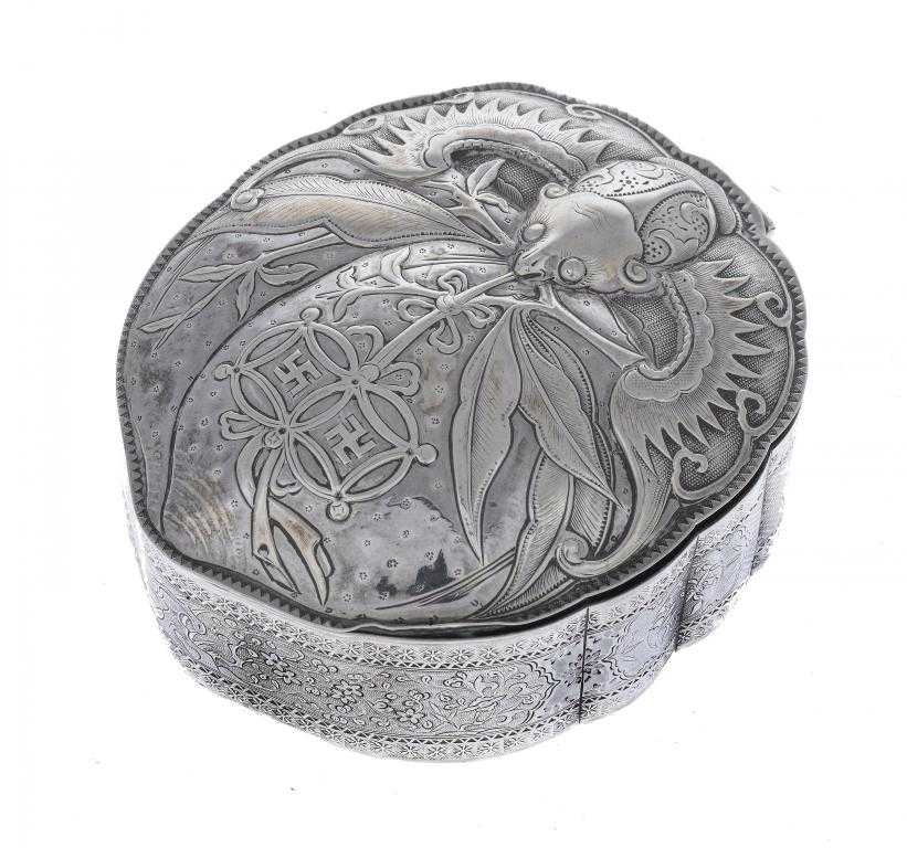 Appraisal: A CHINESE SILVER BOX of leaf shape the repouss lid