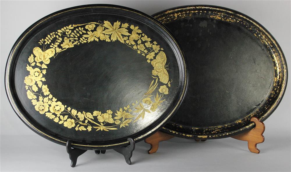 Appraisal: TWO BLACK AND GILT OVAL TRAYS one of tin with