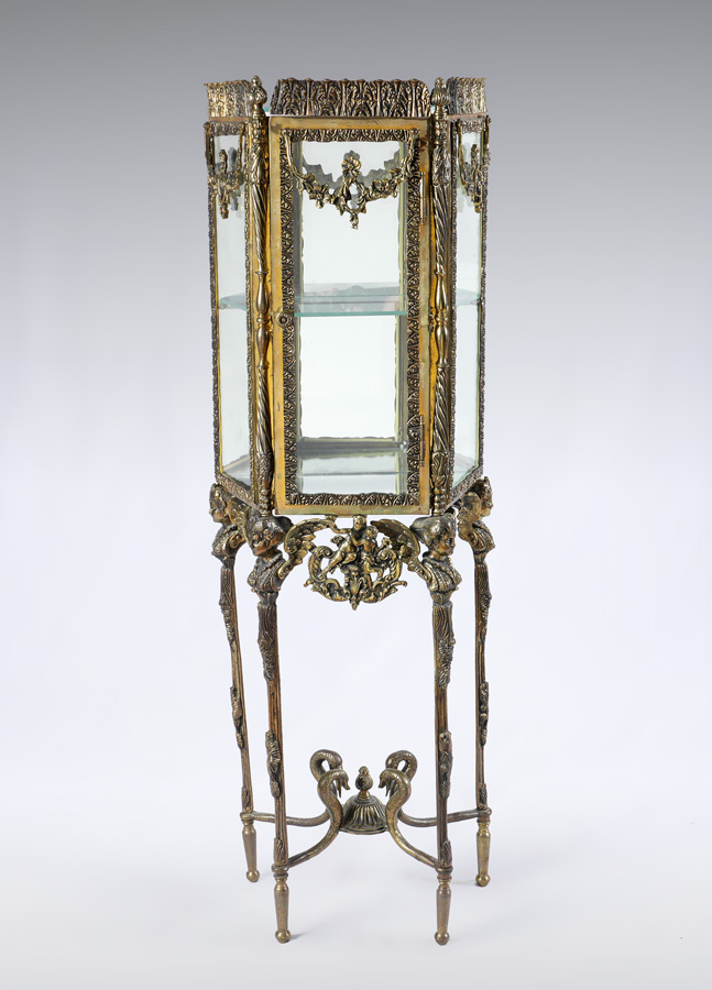 Appraisal: DIMINUTIVE ROCOCO STYLE DISPLAY CABINET Cast brass frame glass top