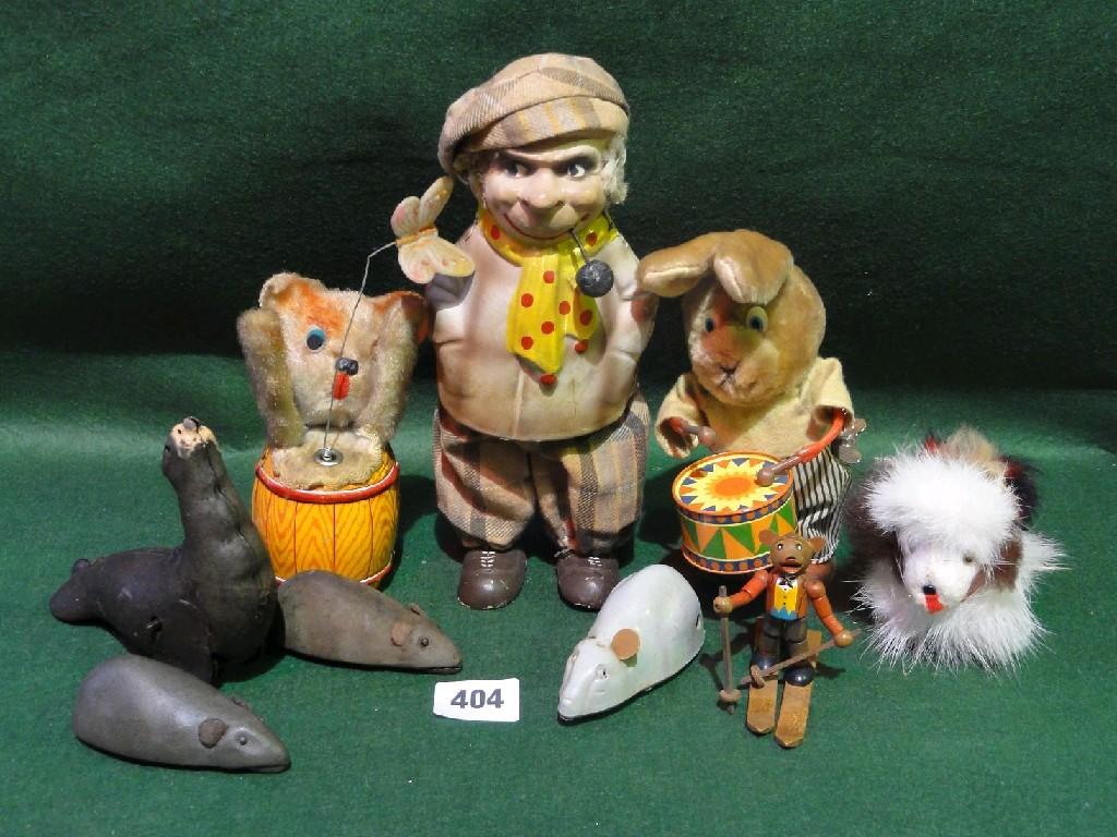 Appraisal: A small collection of clockwork toys including a drumming rabbit