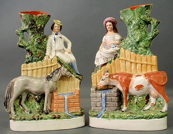 Appraisal: Pair of Staffordshire spill vases with a man and a