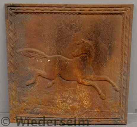 Appraisal: Reproduction cast iron fireback with a relief running horse x