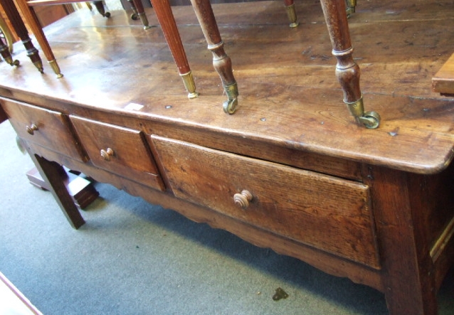 Appraisal: A th century French oak side table the plank top