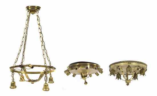 Appraisal: A Collection of Three Circular Brass Fixtures of various forms