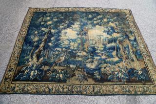 Appraisal: A Flemish Verdure Tapestry Woven with a leafy forest landscape