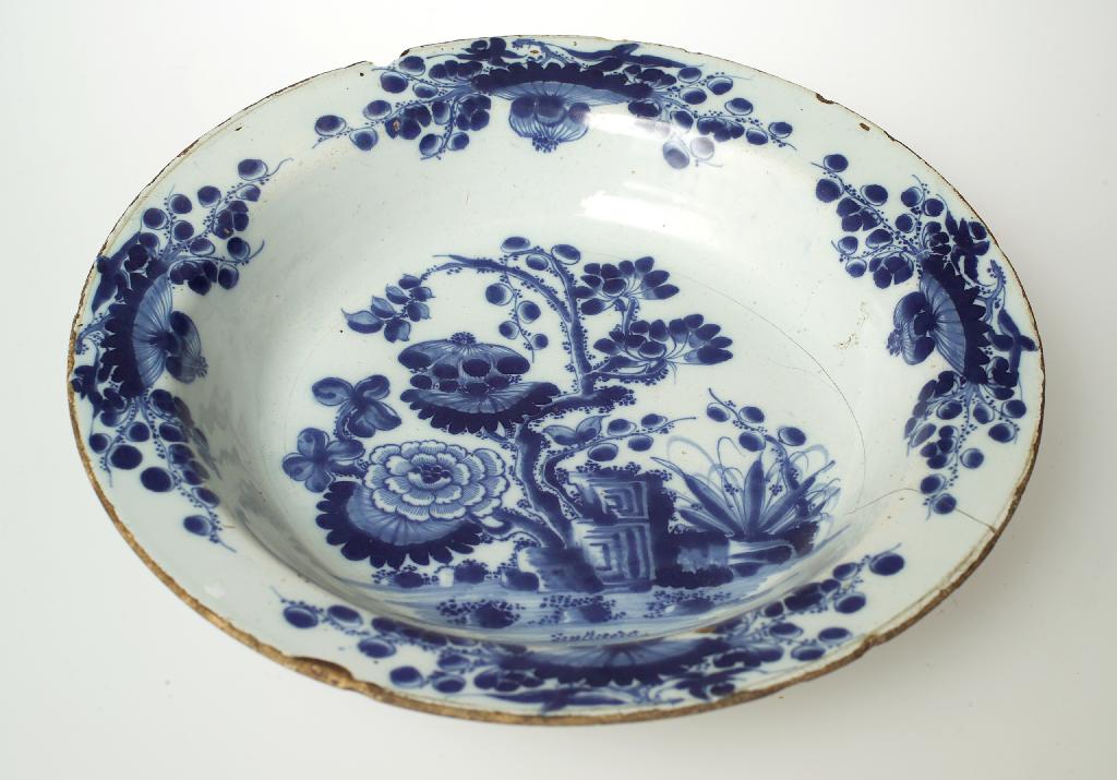 Appraisal: DUTCH DELFT BLUE AND WHITE DISH c painted with an