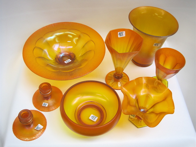 Appraisal: EIGHT PIECES ORANGE STRETCH GLASS pedestal bowl D x H