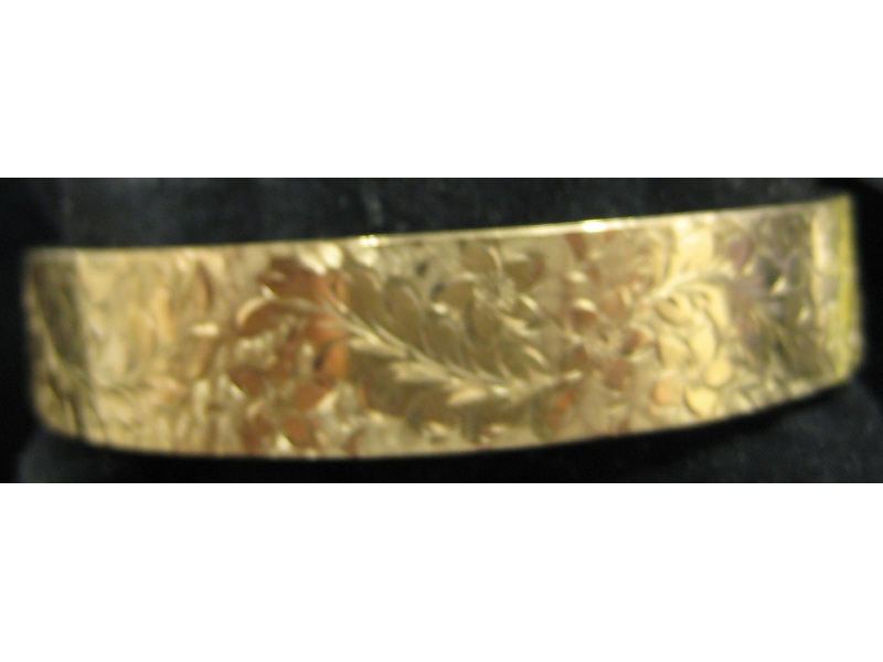 Appraisal: BANGLE BRACELET k yellow gold beautifully engraved bangle bracelet Estimate