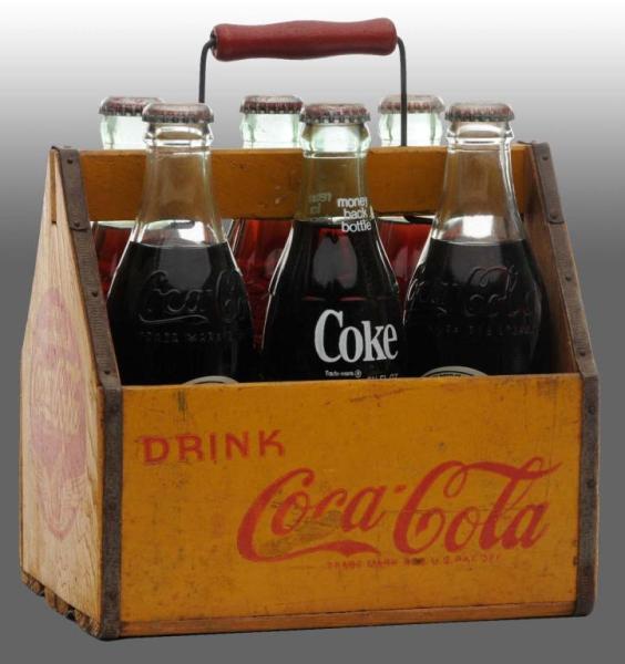 Appraisal: Wooden Coca-Cola -Pack Carrier with Bottles Description A few small