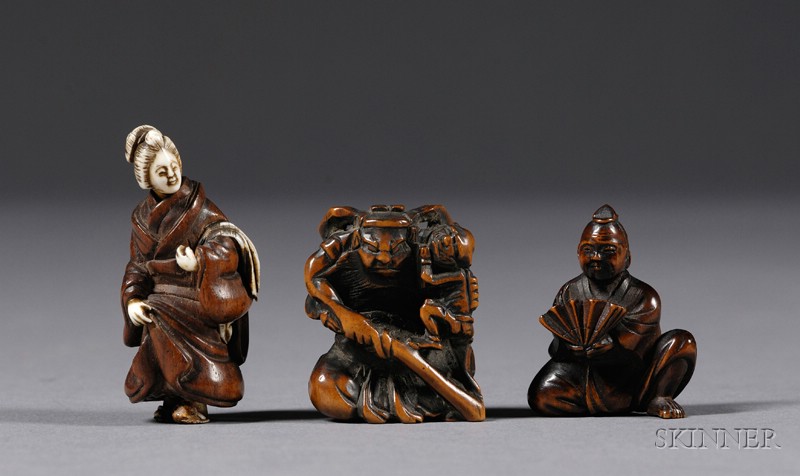 Appraisal: Three Netsuke th century two wood toggles a man with