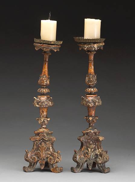 Appraisal: A pair of Italian Neoclassical painted and carved wood prickets