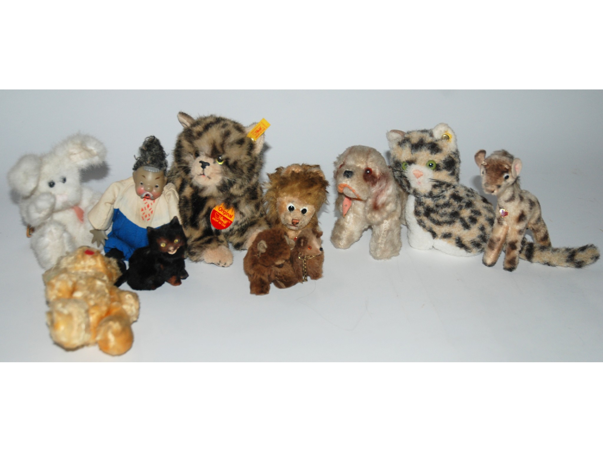 Appraisal: Two modern Steiff cats two Berg soft toys Lion and