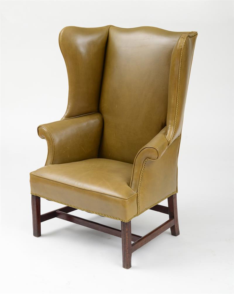 Appraisal: GEORGE III CARVED MAHOGANY WING ARMCHAIR With shaped wings and